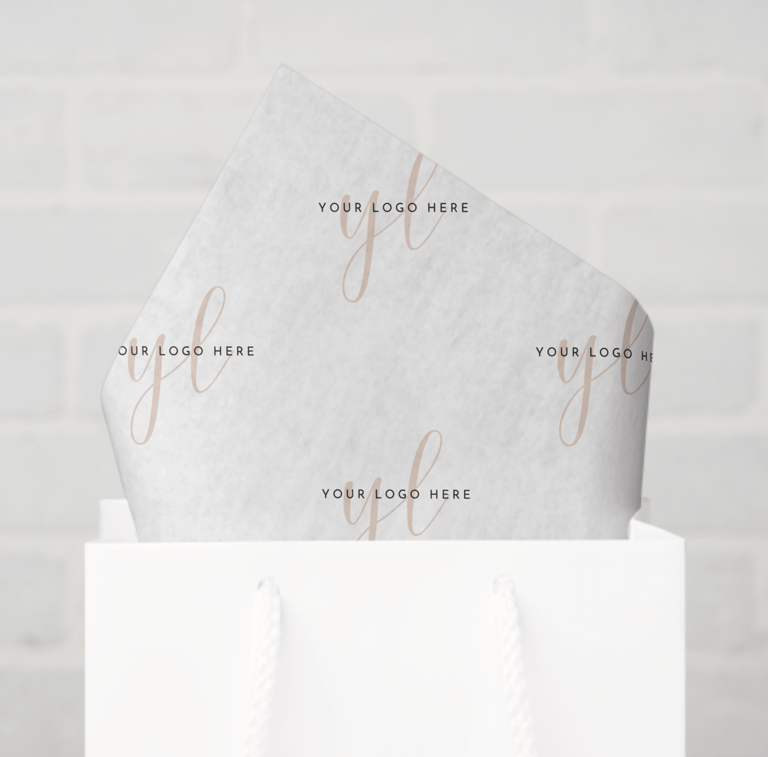 a white bag with white tissue paper and a white bag