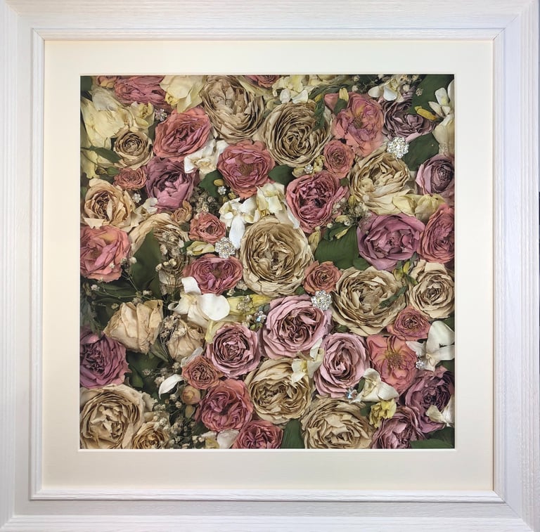 a flower wall style preserved wedding bouquet of beautiful soft hues