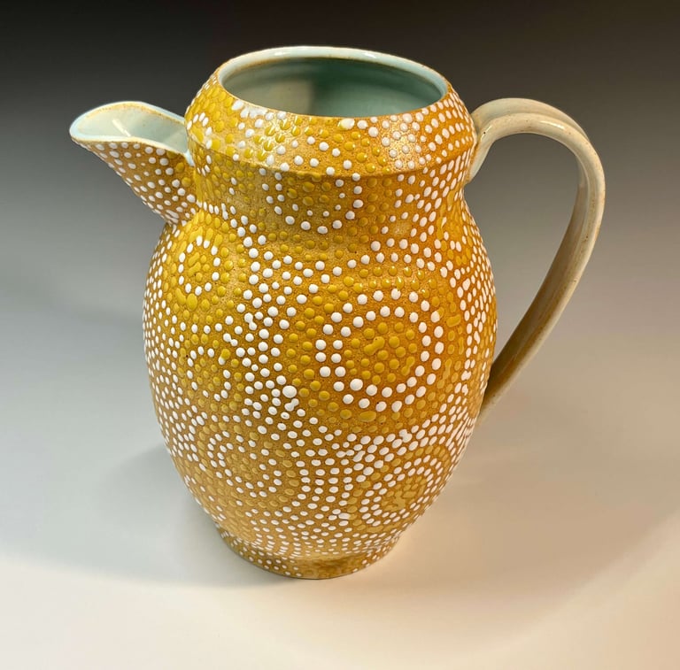 Large pitcher, stoneware, glazed on inside, dotted on outside