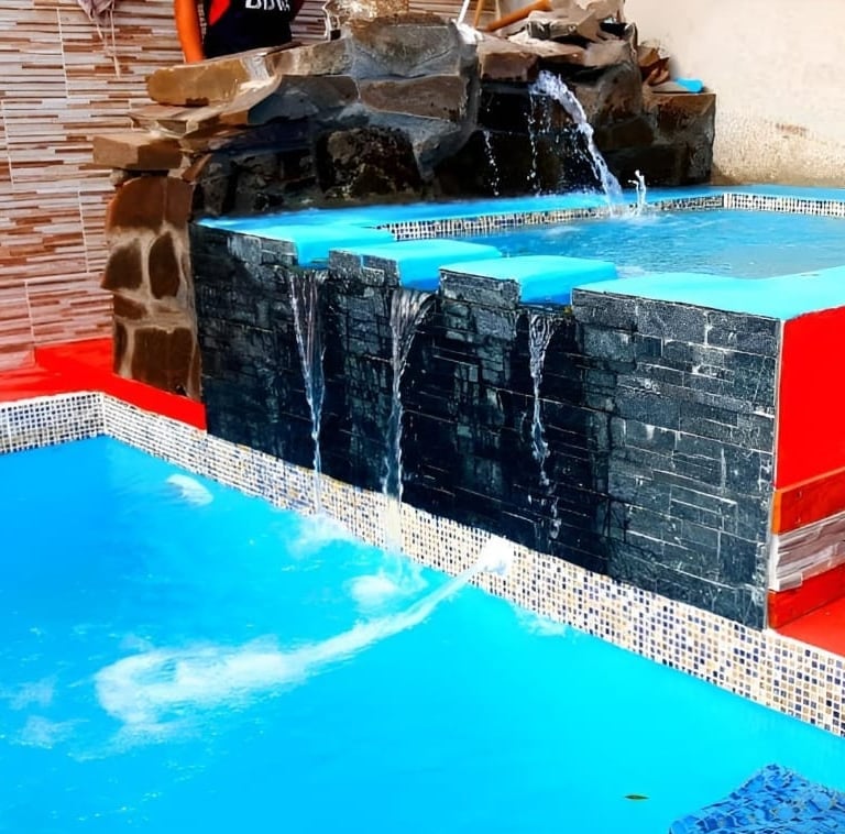 a pool with a waterfall and a waterfall