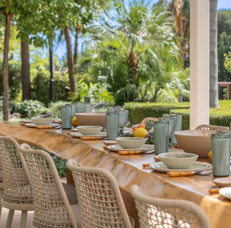 Spacious wooden dining table in the outdoor dining area of Villa Serenity