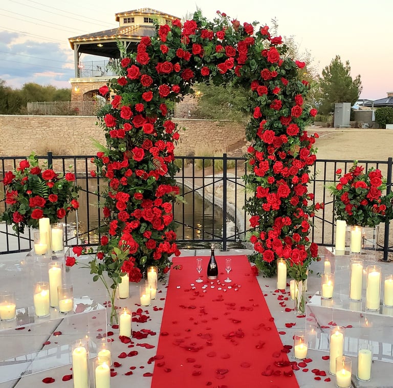 romantic red rose wedding ceremony arch red carpet surprise proposal with candles and rose petals