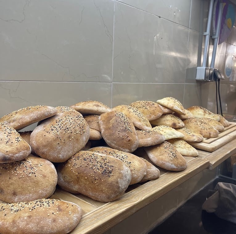  logo zagros gemüse kebap berlin a bunch of breaded breaded breads on a table
