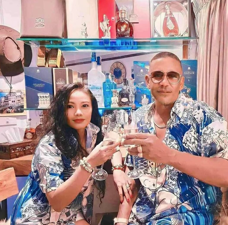 Mark Adam Cottonham and wife toasting in Thailand