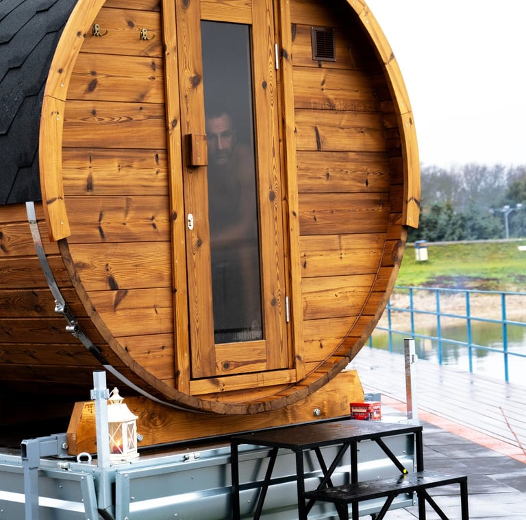 a barrel of sauna sitting on a trailer
