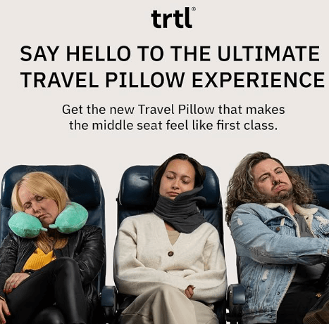 a group of people sitting in chairs with travel pillows