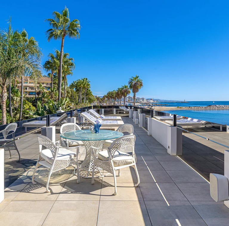 Outdoor dining terrace with sea views in luxury villa Marbella Golden Mile