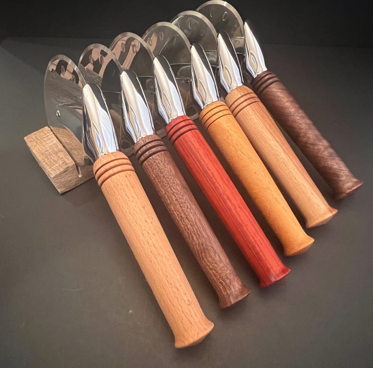 Collection of pizza cutters with various wood handles