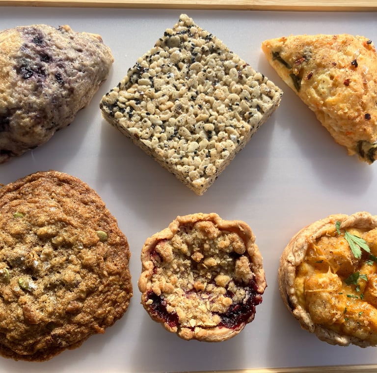 a tray of food and desserts on a tray