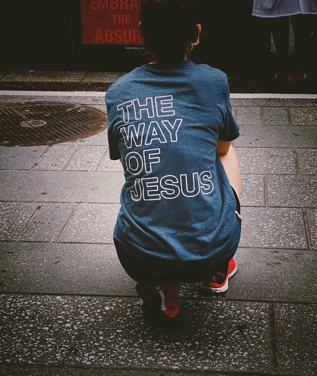 a person showing a tshirt at the back 'The Way of Jesus'