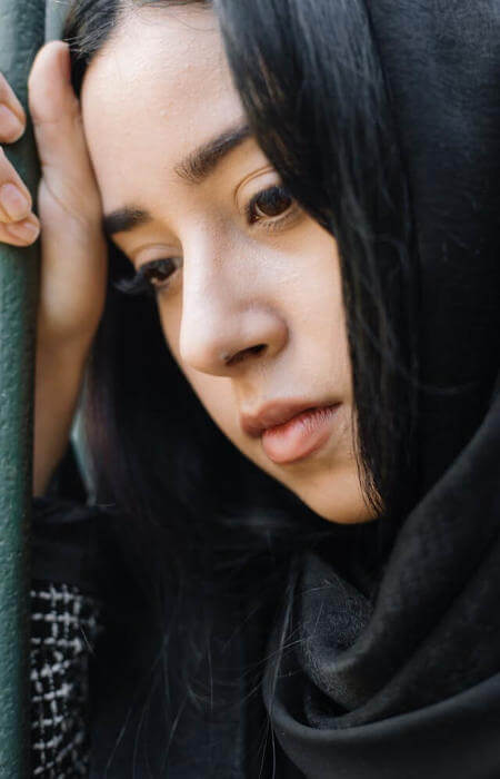 a woman in a black outfit in reflection