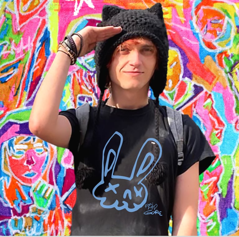 Reid Gorecki wearing a Reid Gore shirt and saluting in a cat hat