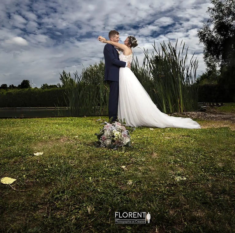 fantastic wedding photographer florent lille saint omer  paris bride and groom standing in a field