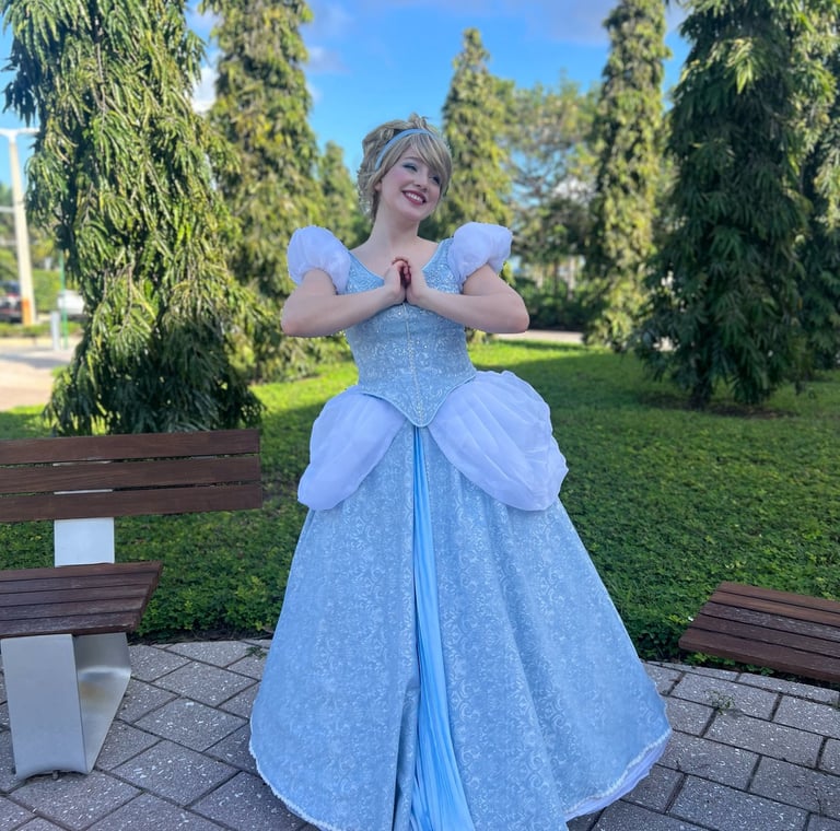 a woman in a blue dress as Cindy