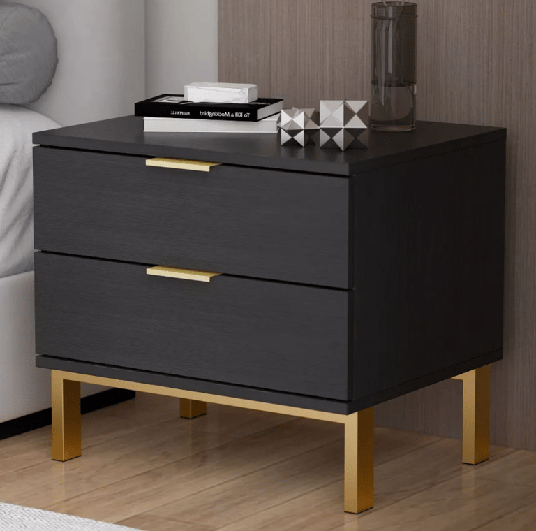 Modern black nightstand with two drawers and gold metal legs for contemporary bedroom decor.