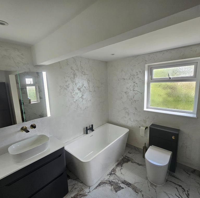 a bathroom with a tub tub and a toilet