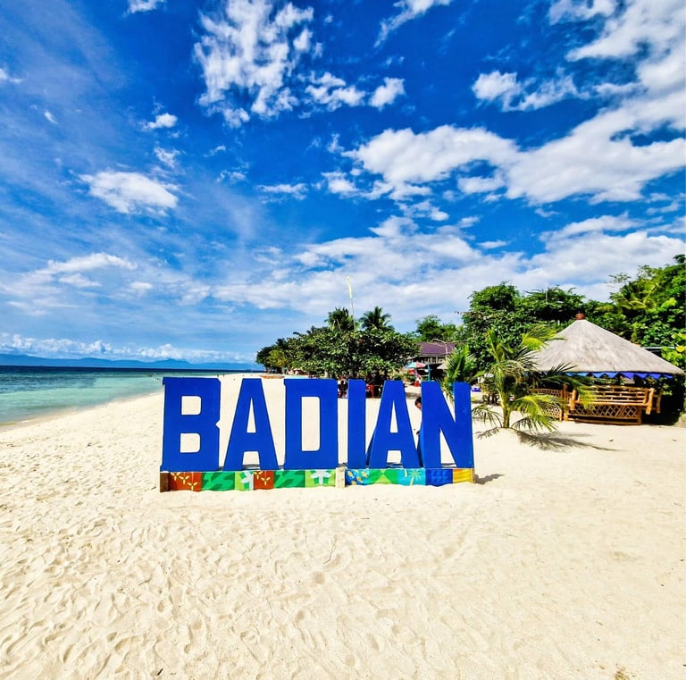 lambug beach with the sign saying badian - just waiting for YOU to take a picture