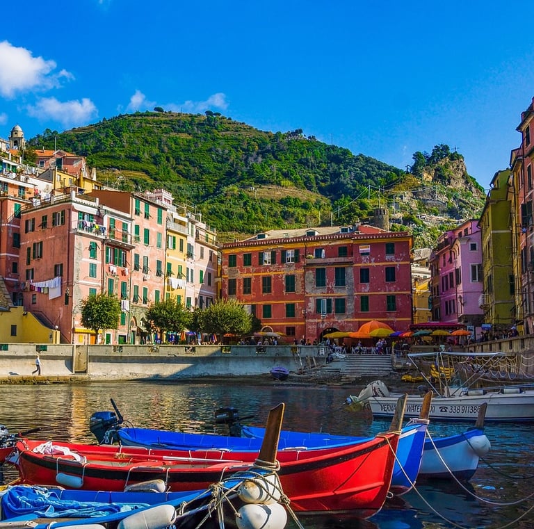 italian town with colorful boats on water