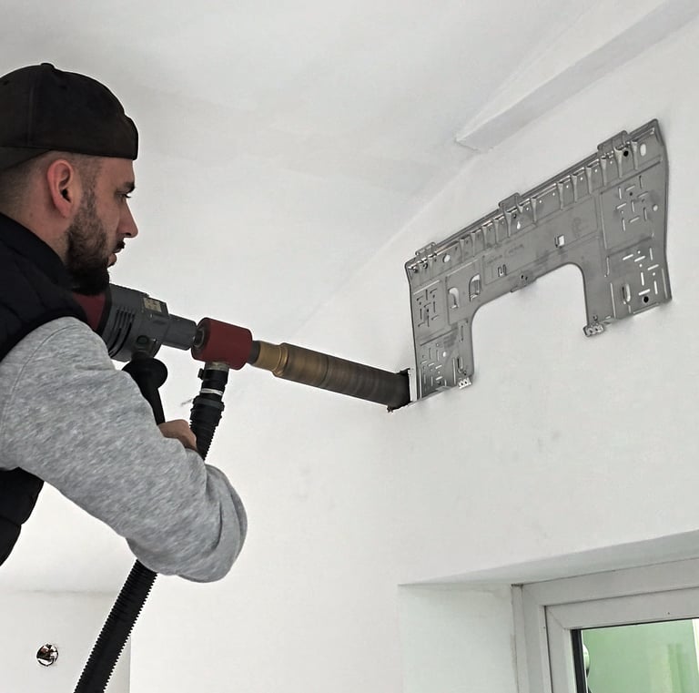 Traversée murale par carottage d'un mur pour unité de clim