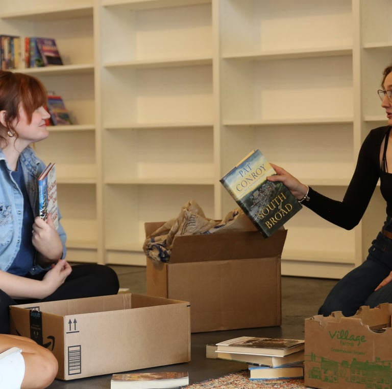 4 people sorting through books at Marigolds Bookstore