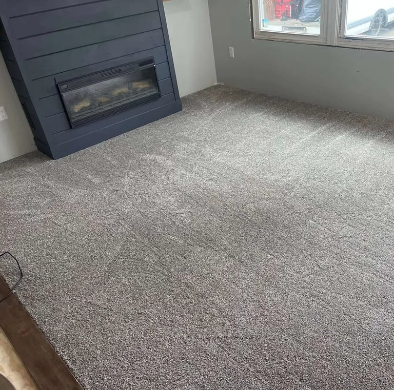 Cozy bedroom with soft grey plush carpet installed by Master Carpet, enhancing comfort and style in London, Ontario homes
