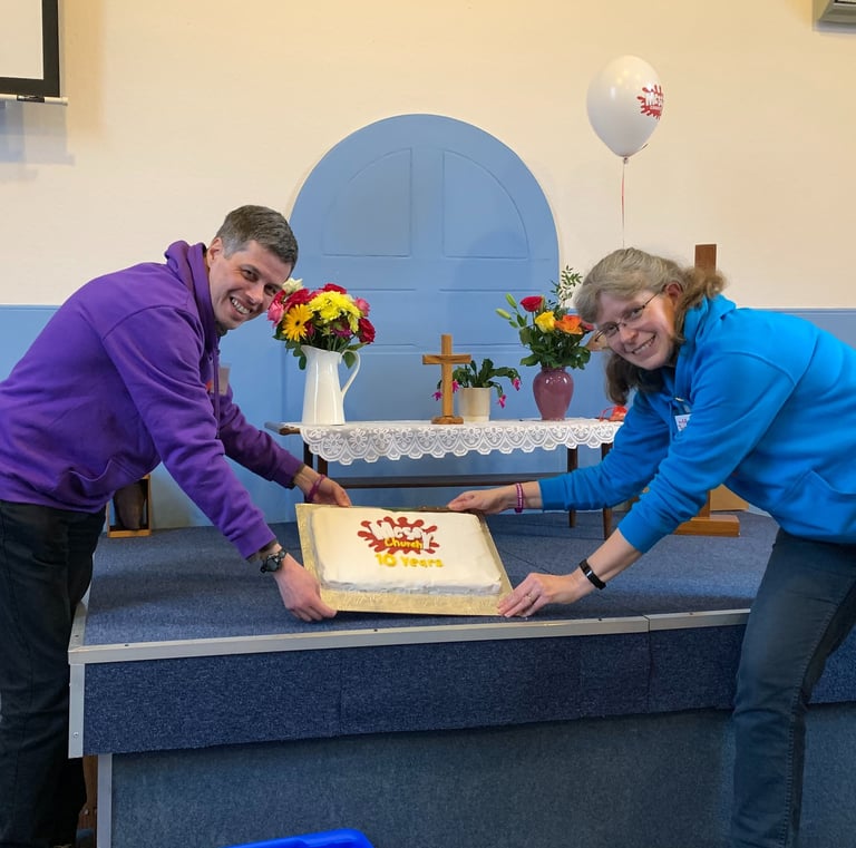 People with a celebration cake