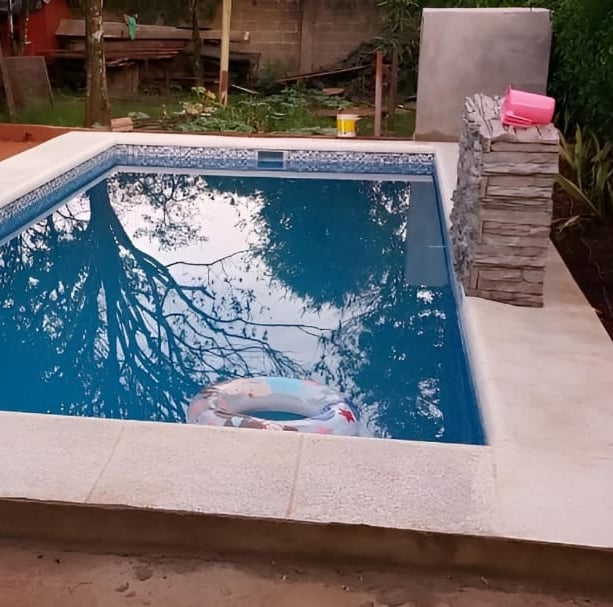 a pool with a pool and a pool in the background