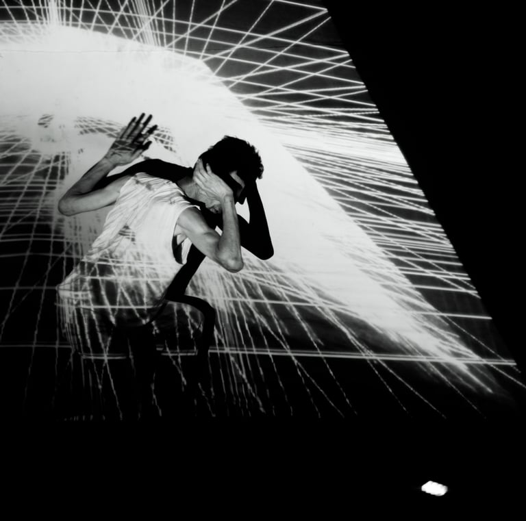 a woman in a white dress is dancing with a light