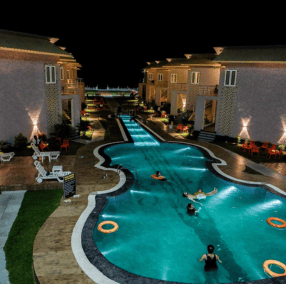 a pool with people swimming in the water