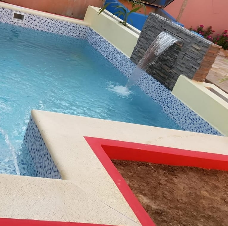 a pool with a red and white pool and a red and white pool