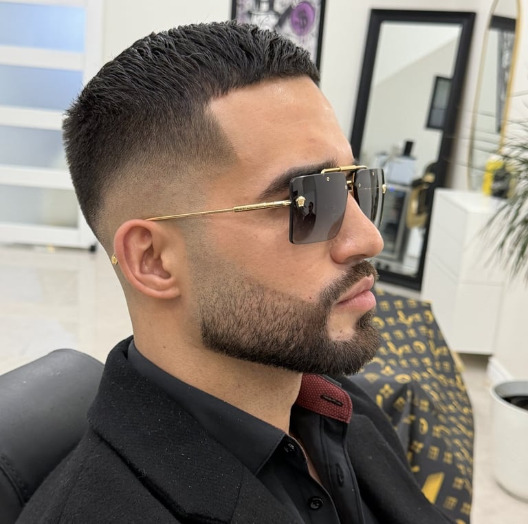 Tapered skin fade and beard trim grooming service at Unlimited Barbershop Etobicoke.