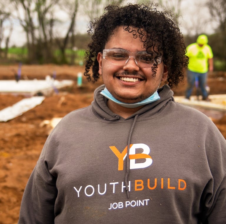 Headshot of Christopher Nichols sporting a Job Point sweatshirt