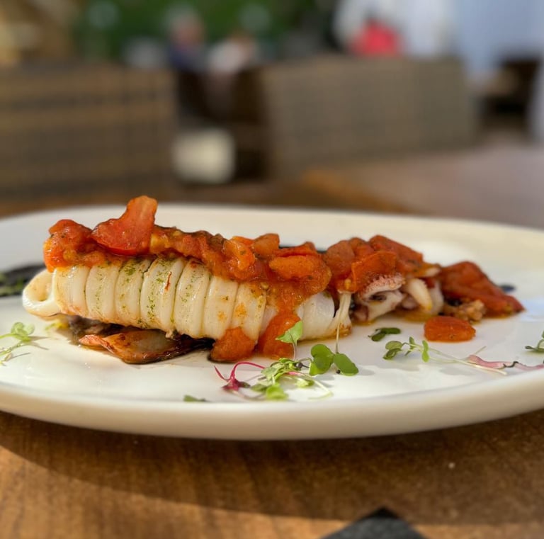 a plate of food on a table with a knife and fork