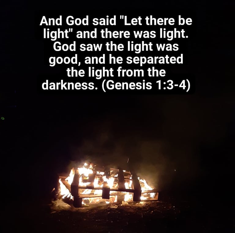 Bonfire with text from Genesis chapter 1