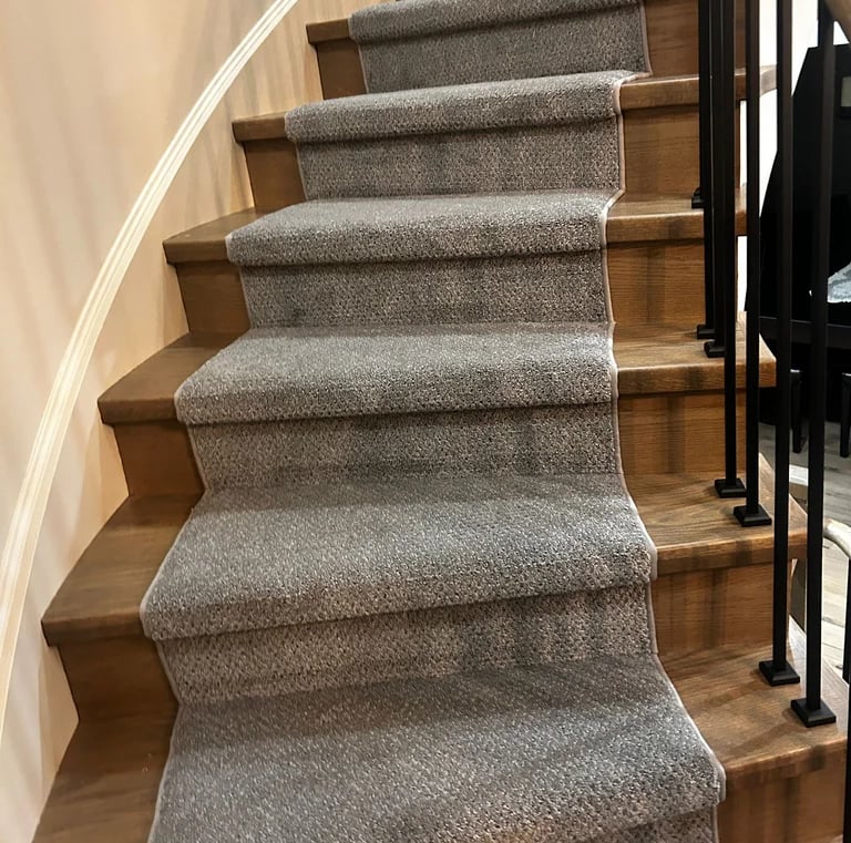 Grey pattern carpet runner installed on hardwood stairs – stylish and durable stair runner in London Ontario home