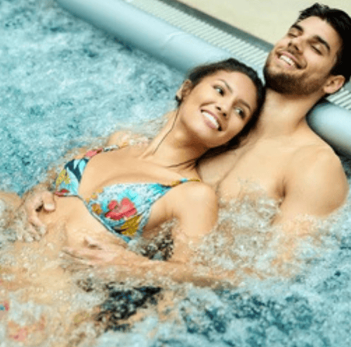 a man and woman in a hot tub