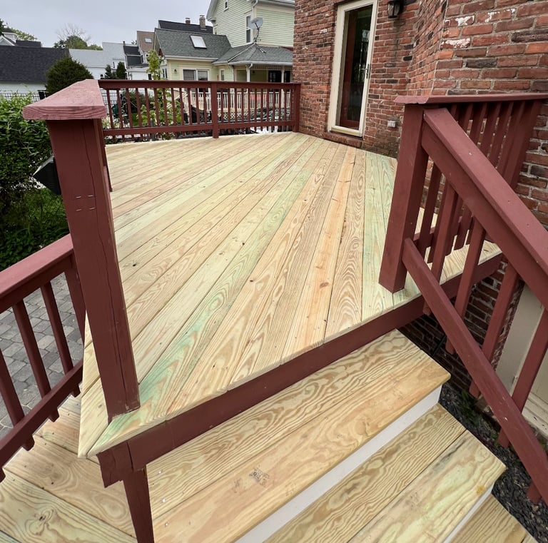 a wooden deck with a wooden deck and stairs