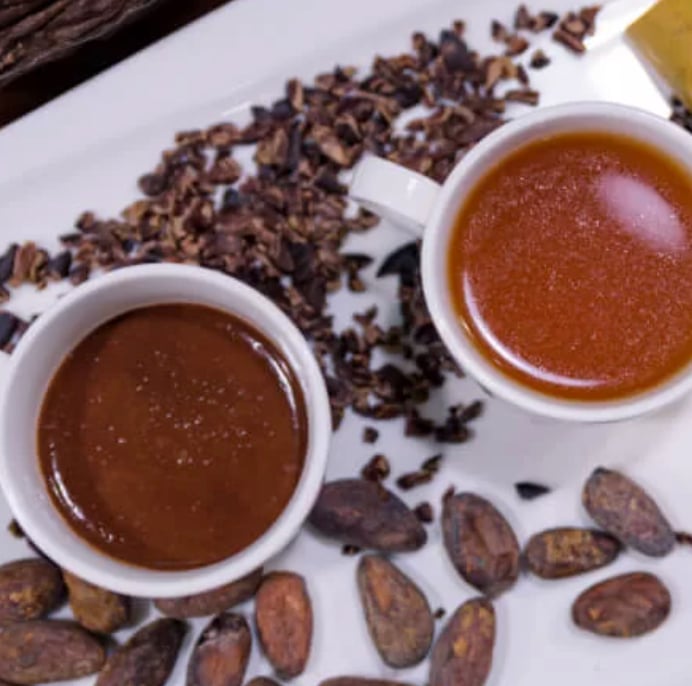 small cups filled with sipping chocolates in a variety of flavors