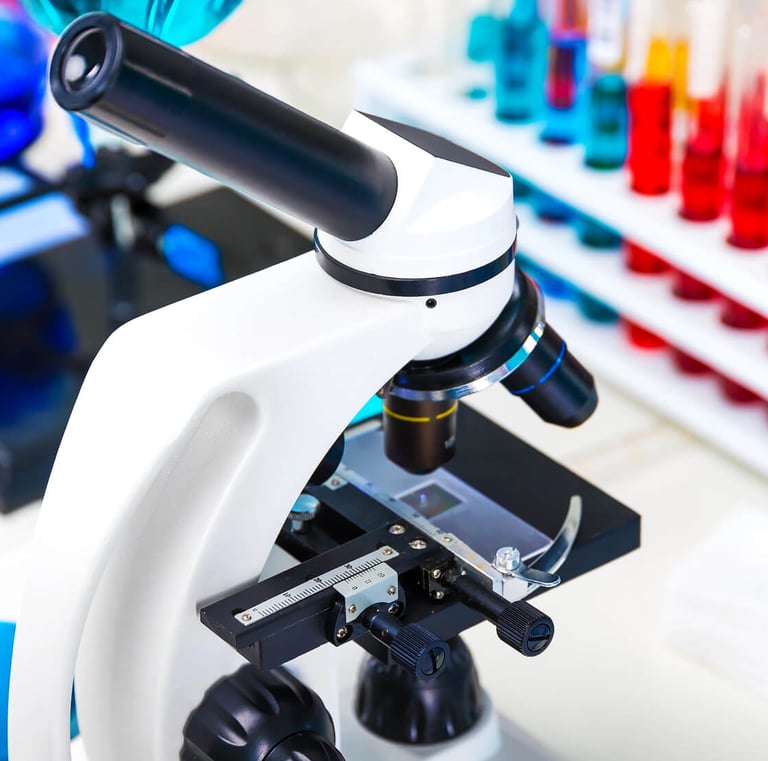 in a laboratory with microscope and sample tubes