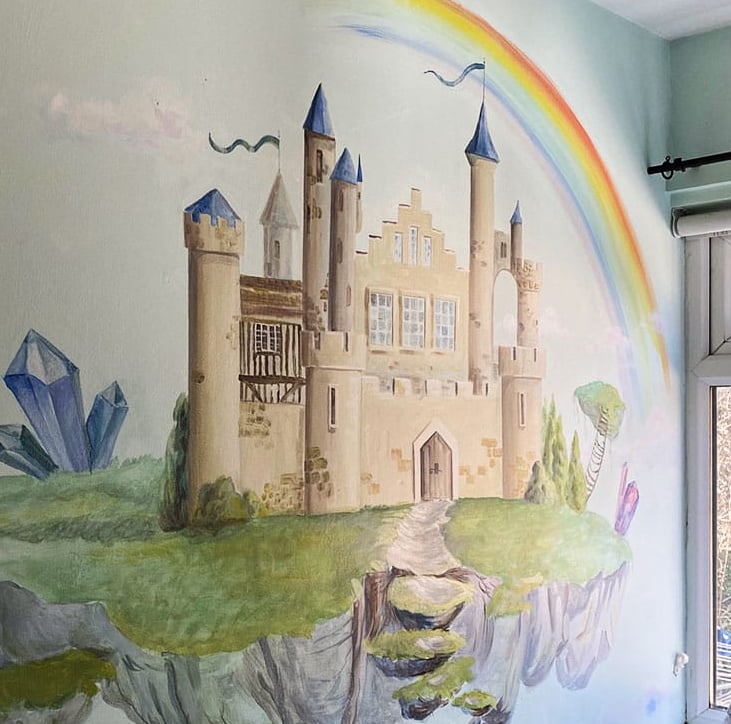 Side angle of kid’s mural with a fantasy castle showcasing its position in context to the layout of the room.