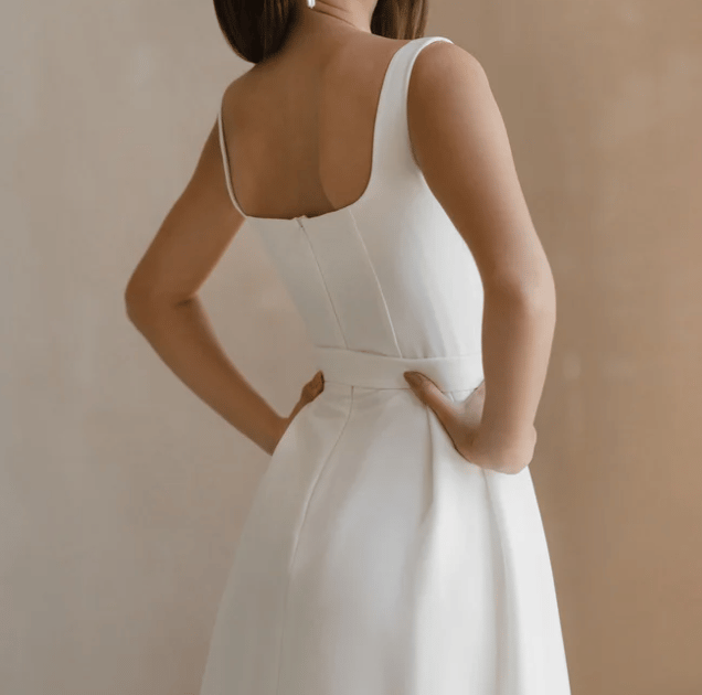 a woman in a white dress with a white dress