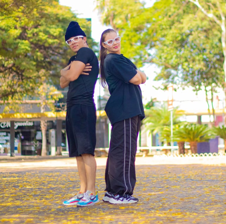 a couple of people standing in a park