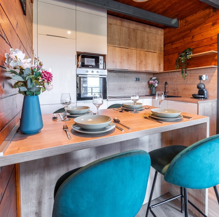 a kitchen with a table and chairs and a table