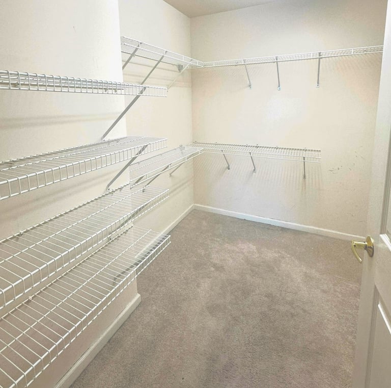 a closet with a closet space for clothes and other items