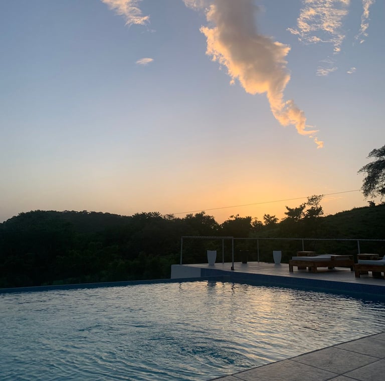a pool with a cloud in the sky