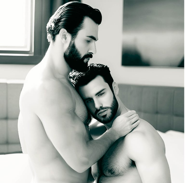 a man and man embracing in a bedroom