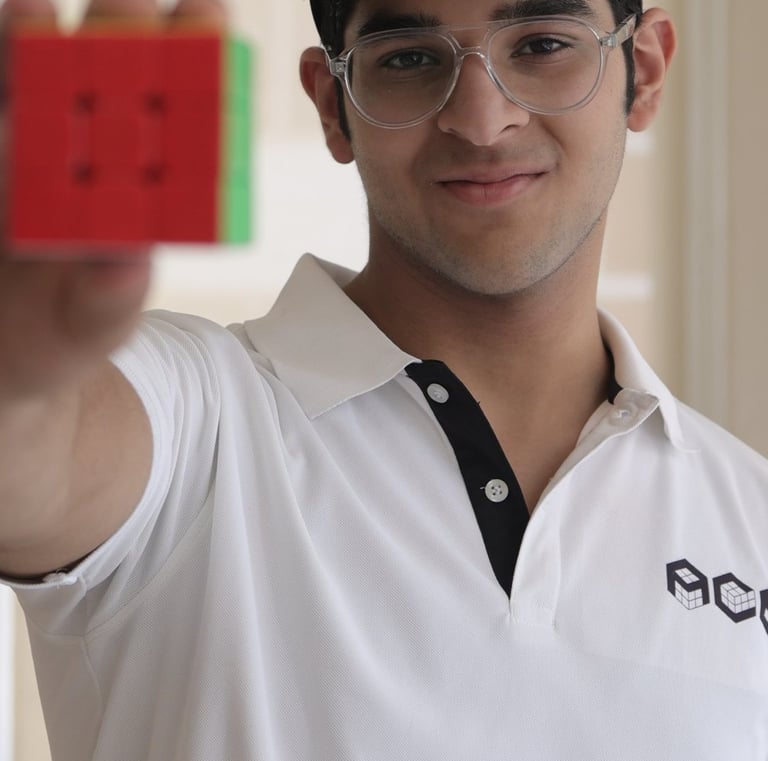 Medhansh Seth holding a cube 