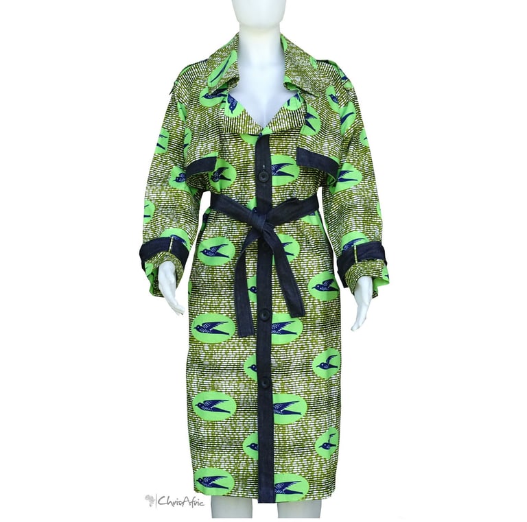 a mannequins woman's green dress with a denim belt