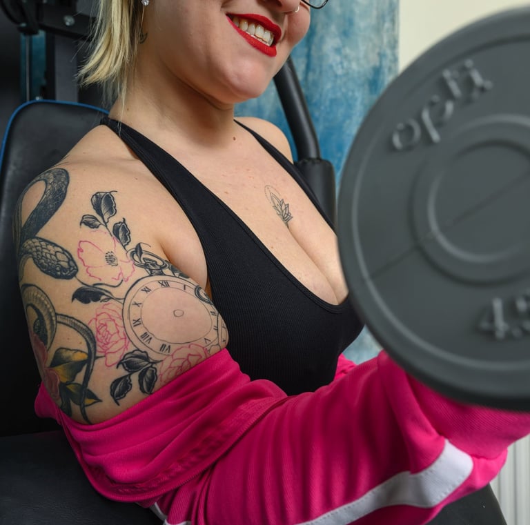 Model exercising with weights during creative studio photoshoot