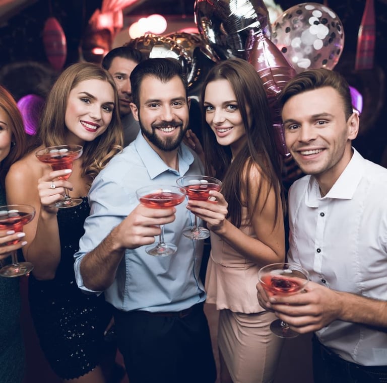 Party Bus Booking Las Vegas group celebration photo inside a party bus holding drinks